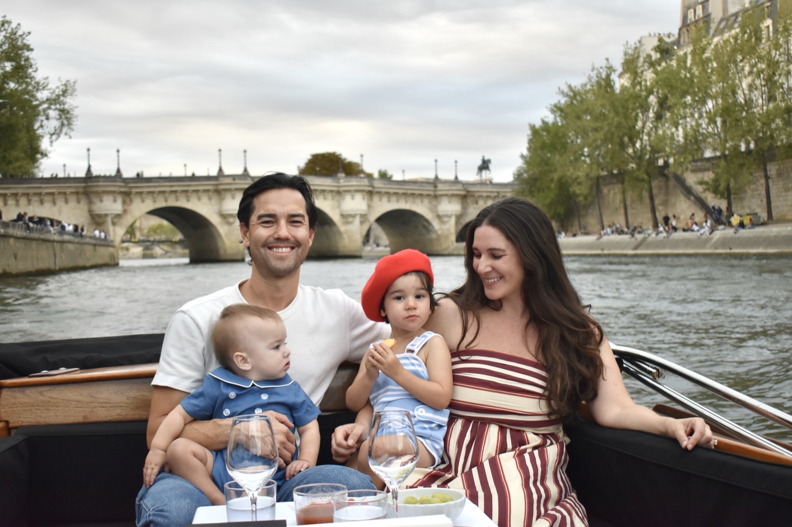 Julia's family on a boat on the Seine, Pont Neuf behind.